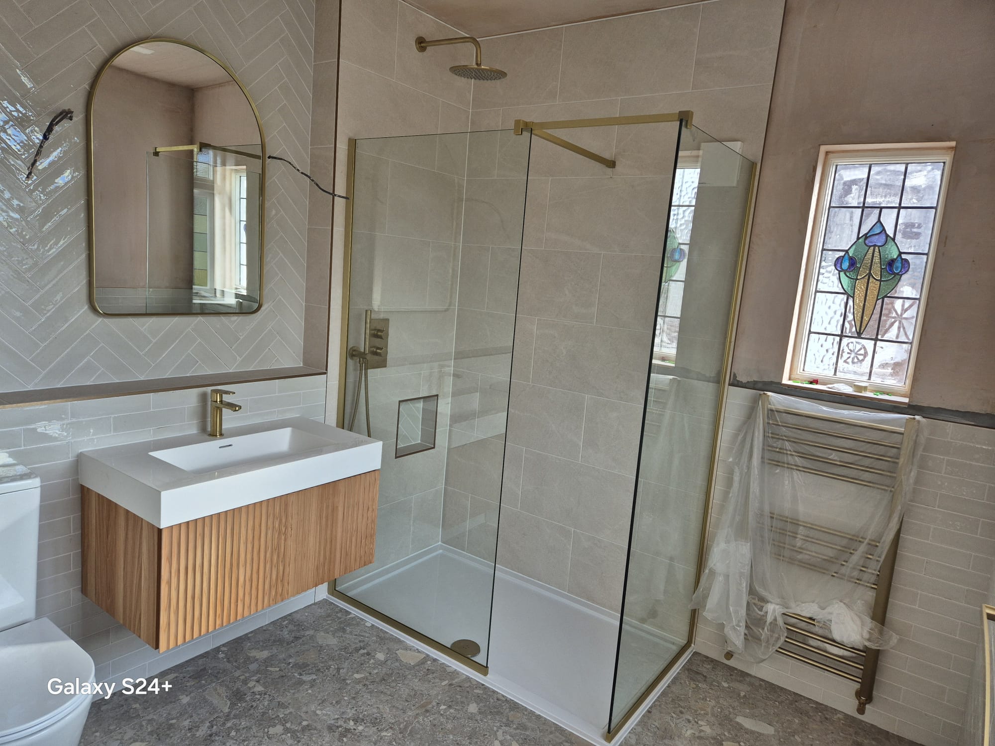 Bathroom refurbishment with new tiling and vanity unit