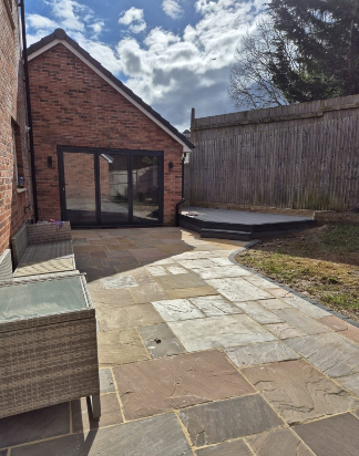 After -- Transformed garden room with patio and landscaping
